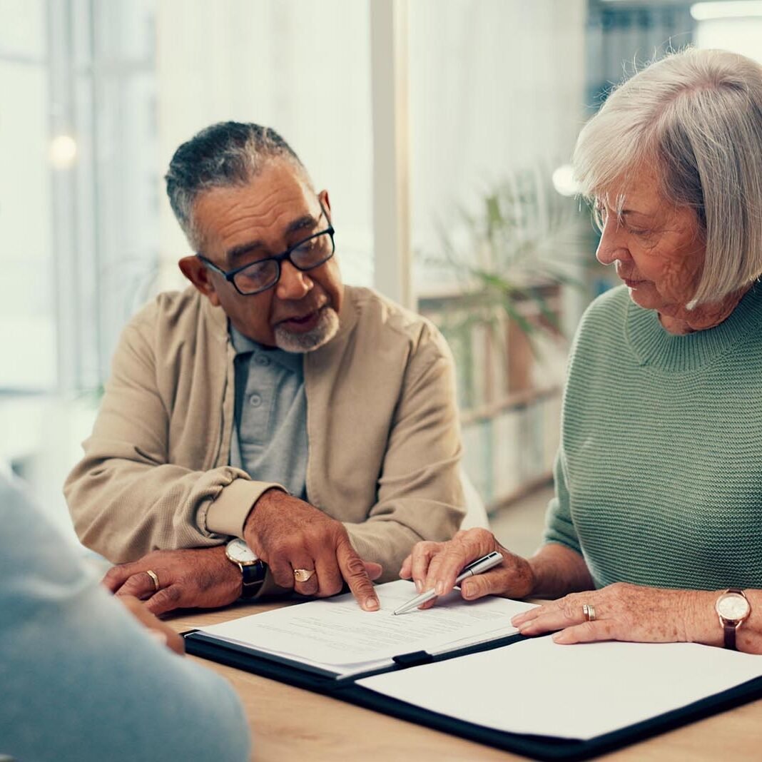 Office, lawyer or old couple with will, contract or document for retirement funding or compliance. Plan, advisor or married elderly clients with legal form or title deed agreement with life insurance.